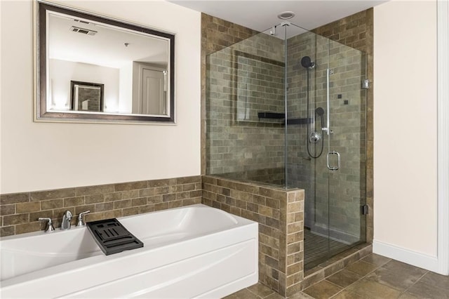 bathroom with tile patterned flooring and plus walk in shower