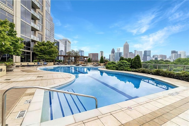 view of swimming pool featuring a patio area