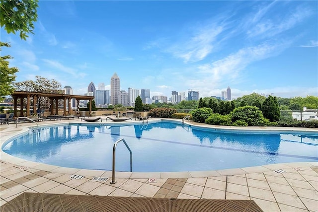 view of swimming pool with a patio