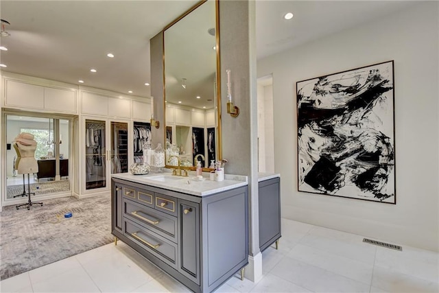 bathroom featuring recessed lighting, visible vents, and vanity