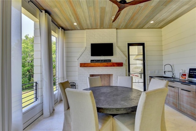 dining space featuring light tile patterned flooring, wooden walls, recessed lighting, wooden ceiling, and a ceiling fan