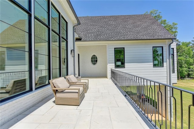view of patio with a balcony