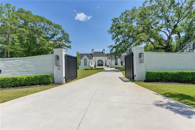 view of gate featuring fence