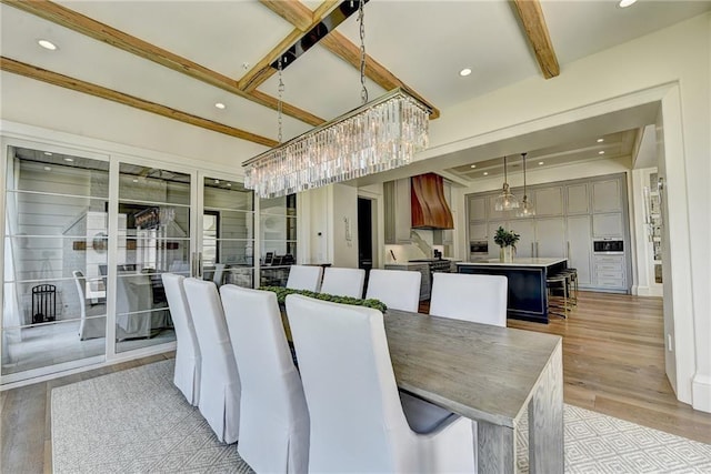 unfurnished dining area with light wood-style floors, beamed ceiling, recessed lighting, and a chandelier