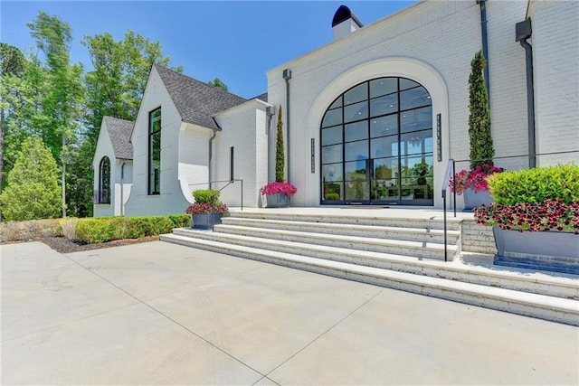 entrance to property with brick siding