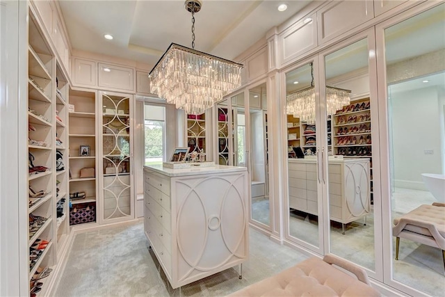 wine cellar featuring recessed lighting, a chandelier, and light carpet