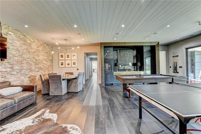 rec room with dark wood-type flooring, wood ceiling, pool table, and brick wall