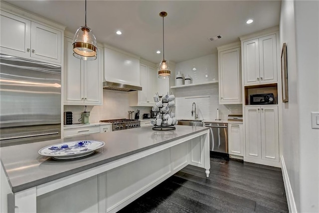 kitchen featuring open shelves, dark wood-style flooring, white cabinets, a sink, and appliances with stainless steel finishes
