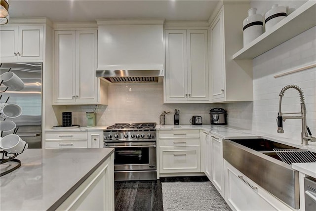 kitchen with a sink, white cabinetry, and appliances with stainless steel finishes