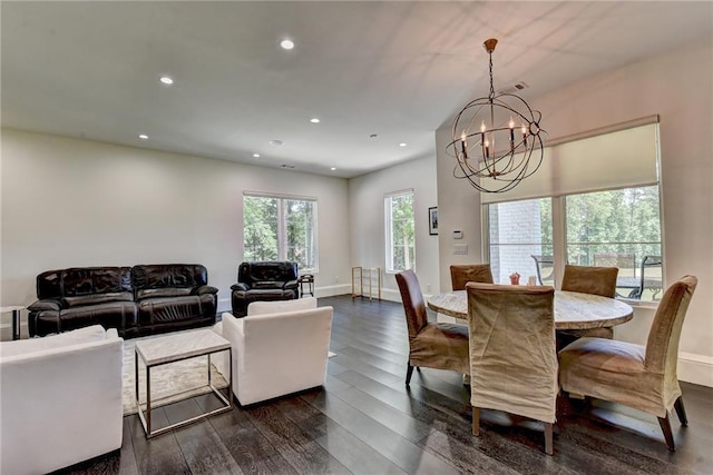 dining room with dark wood-style flooring, baseboards, a chandelier, and recessed lighting