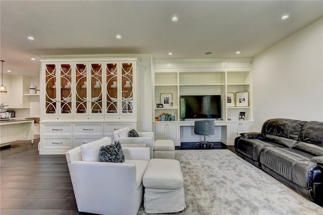 living room featuring recessed lighting and dark wood-style flooring