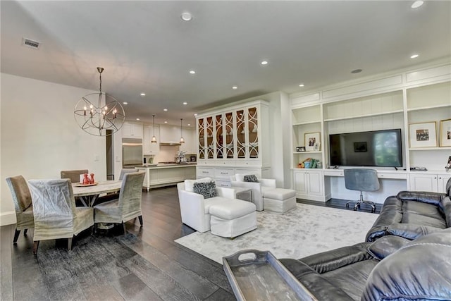 living room featuring recessed lighting, a notable chandelier, dark wood-style flooring, and visible vents