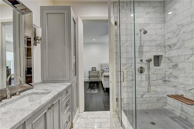 ensuite bathroom featuring vanity, recessed lighting, ensuite bathroom, and a stall shower