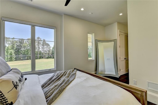 bedroom featuring recessed lighting, ceiling fan, visible vents, and baseboards