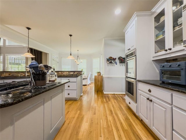 710 Bentgrass Ct, Dacula, GA 30019 - kitchen featuring stainless steel double oven, crown molding, white cabinetry, light wood-style flooring, and plenty of natural light