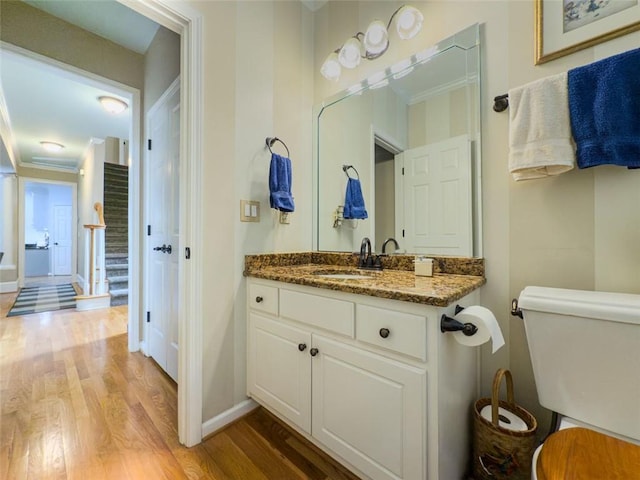 710 Bentgrass Ct, Dacula, GA 30019 - bathroom with wood finished floors, ornamental molding, and vanity