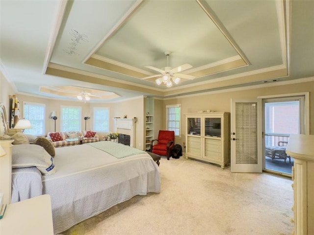 710 Bentgrass Ct, Dacula, GA 30019 - bedroom featuring a tray ceiling, ornamental molding, light colored carpet, and a ceiling fan