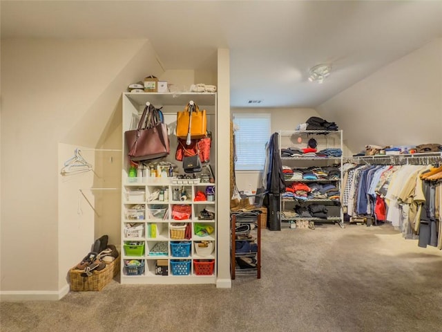 710 Bentgrass Ct, Dacula, GA 30019 - walk in closet with carpet flooring and lofted ceiling
