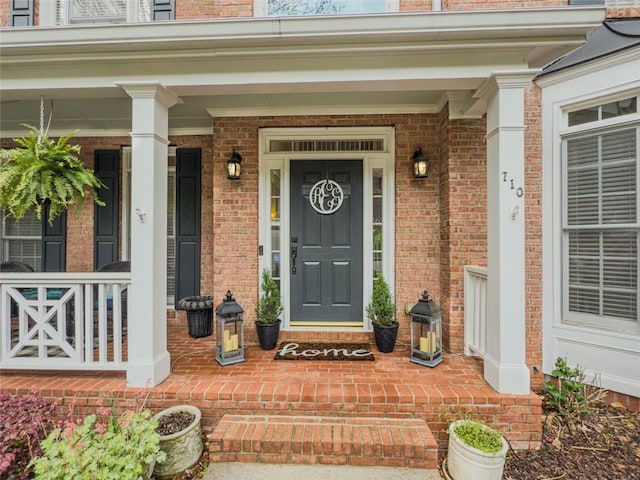 710 Bentgrass Ct, Dacula, GA 30019 - property entrance featuring brick siding and covered porch