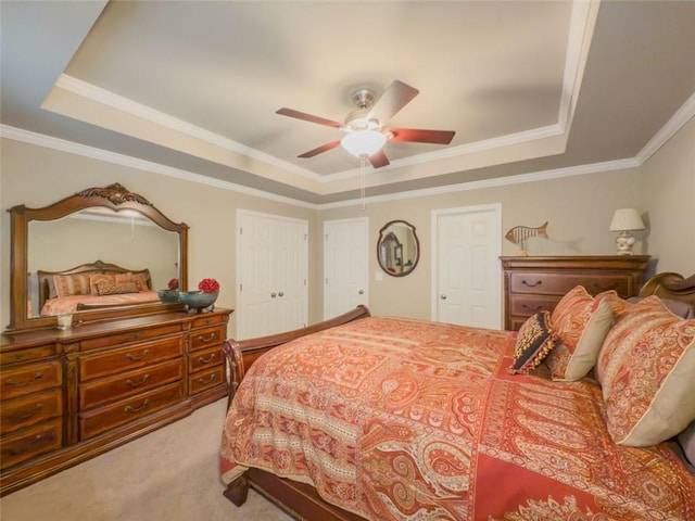 710 Bentgrass Ct, Dacula, GA 30019 - bedroom featuring a tray ceiling, carpet flooring, crown molding, and ceiling fan