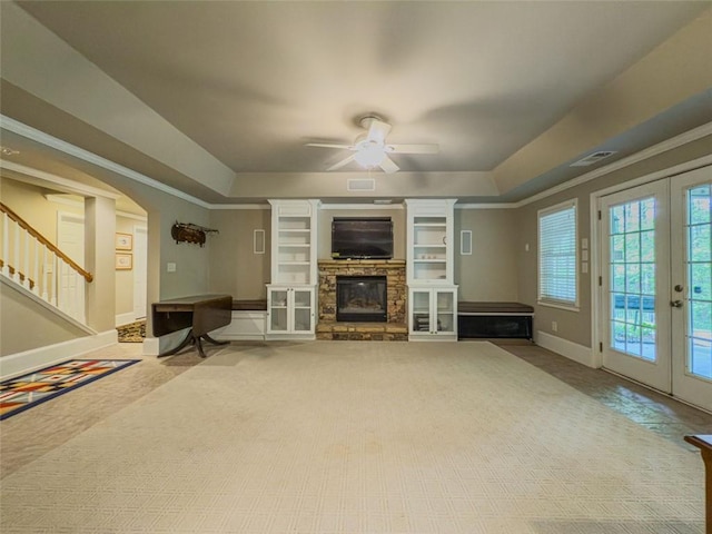 710 Bentgrass Ct, Dacula, GA 30019 - unfurnished living room with a raised ceiling, a fireplace, and french doors