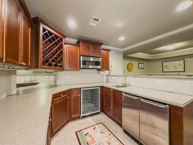 710 Bentgrass Ct, Dacula, GA 30019 - kitchen with beverage cooler, appliances with stainless steel finishes, crown molding, tasteful backsplash, and light countertops