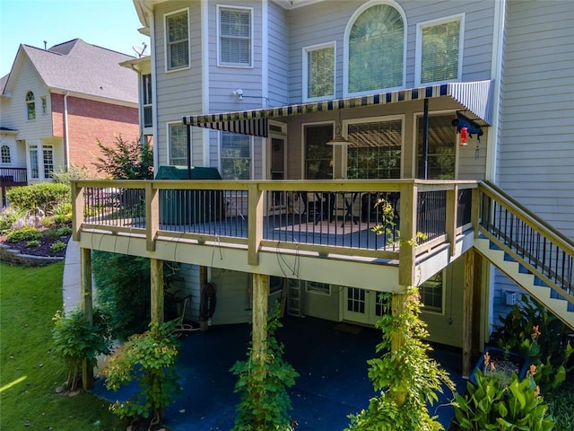 710 Bentgrass Ct, Dacula, GA 30019 - back of house with a wooden deck and stairway