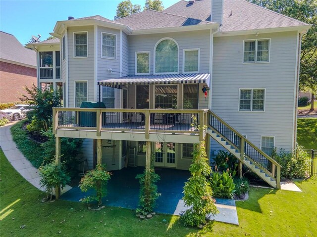 710 Bentgrass Ct, Dacula, GA 30019 - back of property with a yard, a patio, a wooden deck, stairway, and a shingled roof