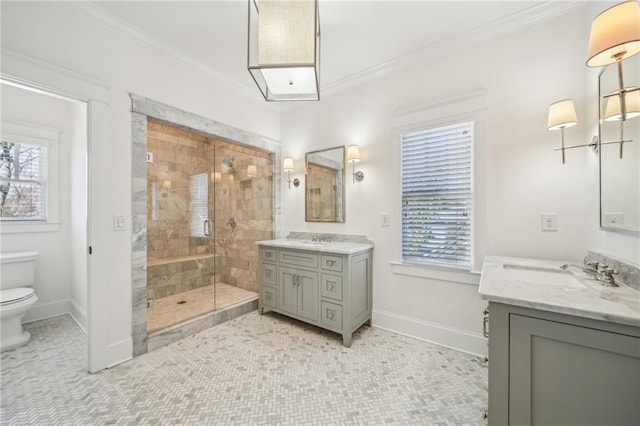 full bath with a sink, a stall shower, and ornamental molding