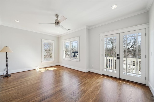 interior space with french doors, baseboards, and ornamental molding