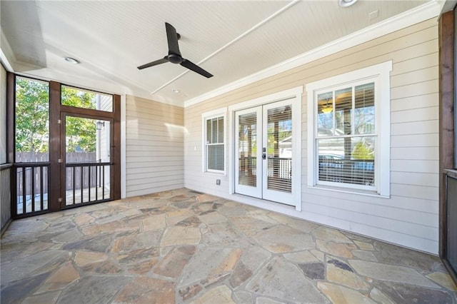 unfurnished sunroom with french doors and ceiling fan