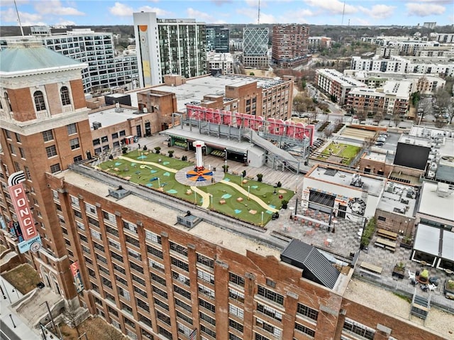 birds eye view of property featuring a city view