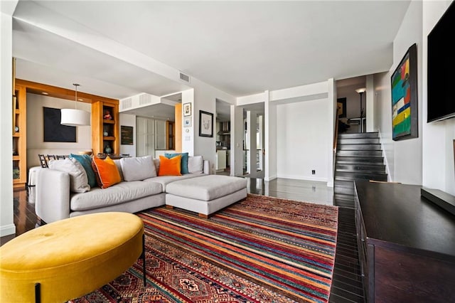145 15th St NE Unit 435, Atlanta, GA 30309 - living area featuring wood finished floors, stairs, built in features, and baseboards