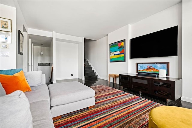 145 15th St NE Unit 435, Atlanta, GA 30309 - living area with wood finished floors, stairs, and baseboards