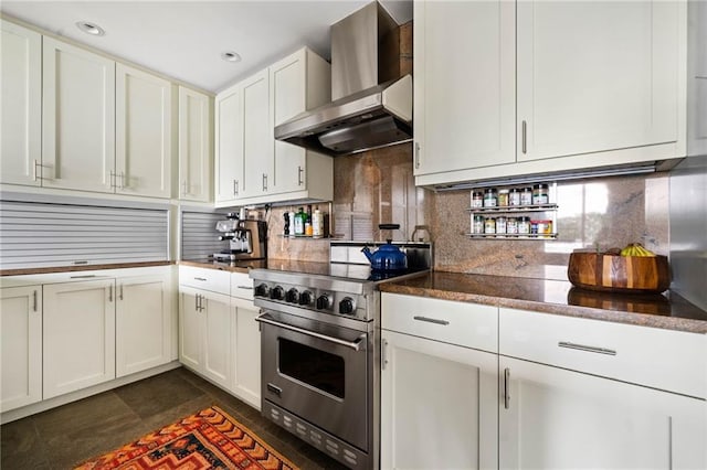 145 15th St NE Unit 435, Atlanta, GA 30309 - kitchen with wall chimney exhaust hood, stainless steel range, decorative backsplash, white cabinetry, and recessed lighting