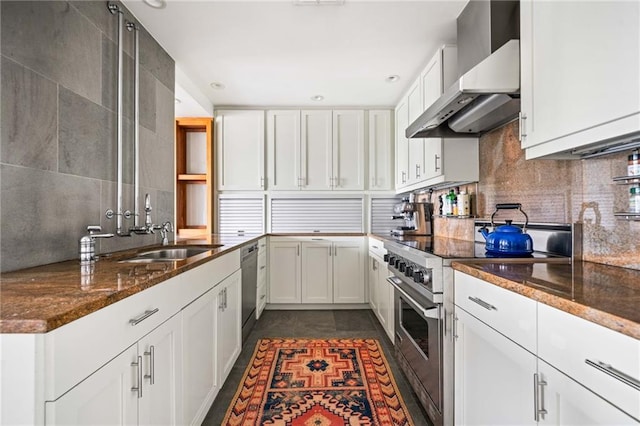 145 15th St NE Unit 435, Atlanta, GA 30309 - kitchen with wall chimney exhaust hood, stainless steel appliances, white cabinetry, dark stone counters, and recessed lighting