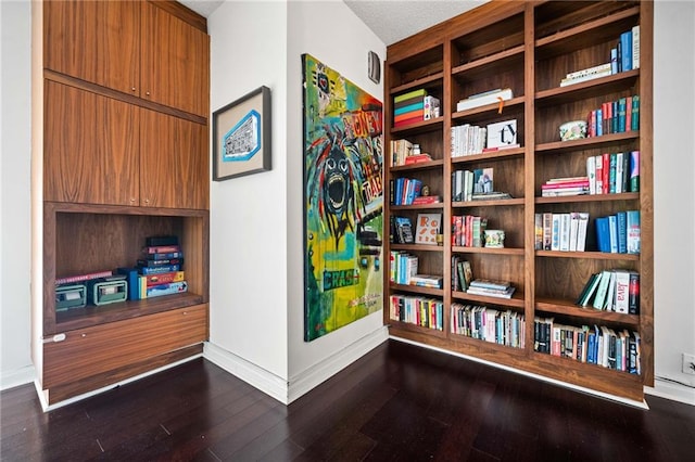 145 15th St NE Unit 435, Atlanta, GA 30309 - living area with baseboards and dark wood-type flooring