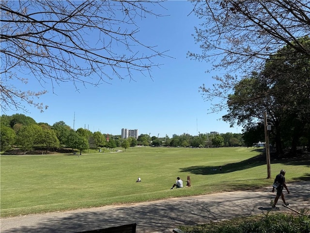145 15th St NE Unit 435, Atlanta, GA 30309 - view of home's community with a yard, view of golf course, and view of wooded area
