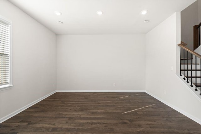 empty room featuring dark wood-type flooring