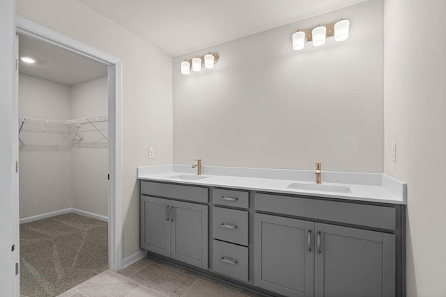 bathroom with tile patterned flooring and vanity