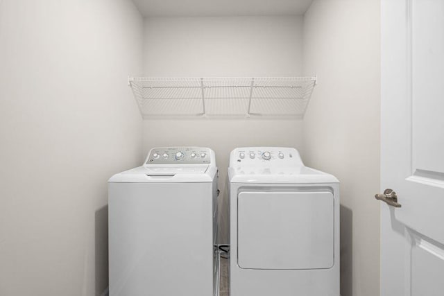 laundry room with washing machine and dryer