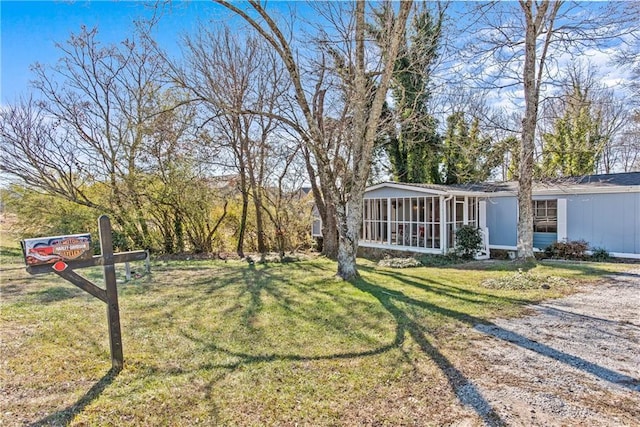 view of yard with a sunroom