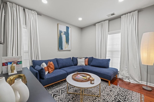 living room with dark hardwood / wood-style floors