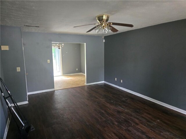 1203 Balboa Ct, Norcross, GA 30093 - spare room featuring wood finished floors, a chandelier, ceiling fan, and baseboards