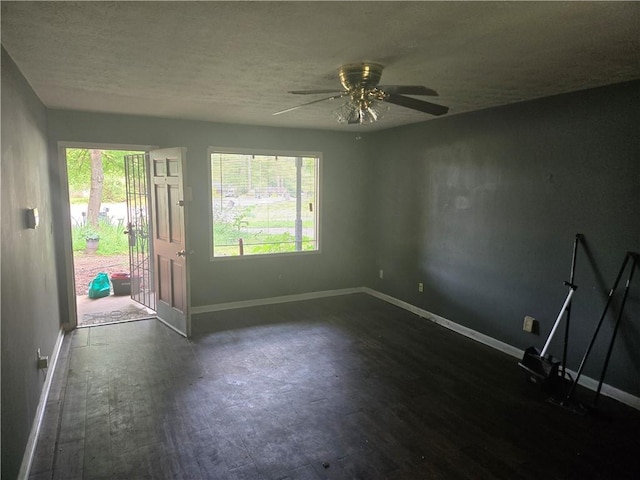1203 Balboa Ct, Norcross, GA 30093 - unfurnished room featuring baseboards, dark wood-type flooring, and a textured ceiling