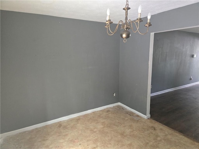 1203 Balboa Ct, Norcross, GA 30093 - empty room featuring a chandelier and baseboards