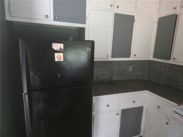 1203 Balboa Ct, Norcross, GA 30093 - kitchen with freestanding refrigerator, dark countertops, and white cabinets