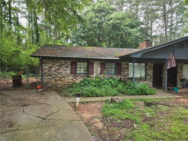 1203 Balboa Ct, Norcross, GA 30093 - view of front of property with a chimney and brick siding