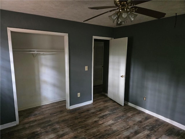 1203 Balboa Ct, Norcross, GA 30093 - unfurnished bedroom with dark wood-style floors, a closet, baseboards, ceiling fan, and a textured ceiling