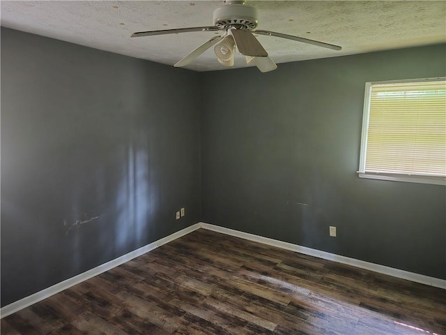 1203 Balboa Ct, Norcross, GA 30093 - empty room featuring dark wood-style flooring, a ceiling fan, a textured ceiling, and baseboards